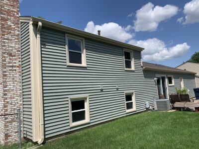 5 Star Highly Reviewed Professional Contractor completes home exterior renovation with new siding, windows, patio and main entry door in Schaumburg, IL